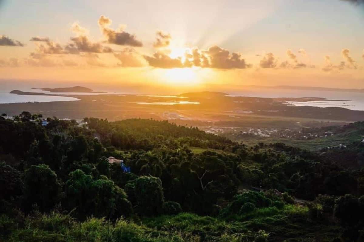 Golden sunset over tropical landscape from the hilltop retreat in Ceiba Puerto Rico